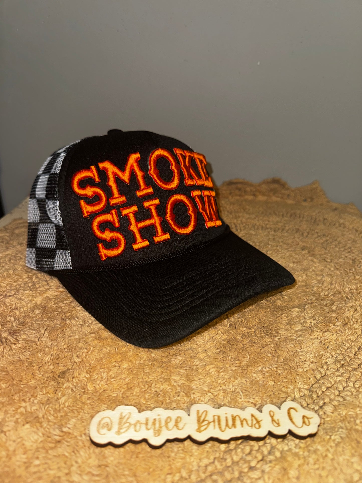 Smoke show black checkered orange letters.  Harley davidson vibes🧡