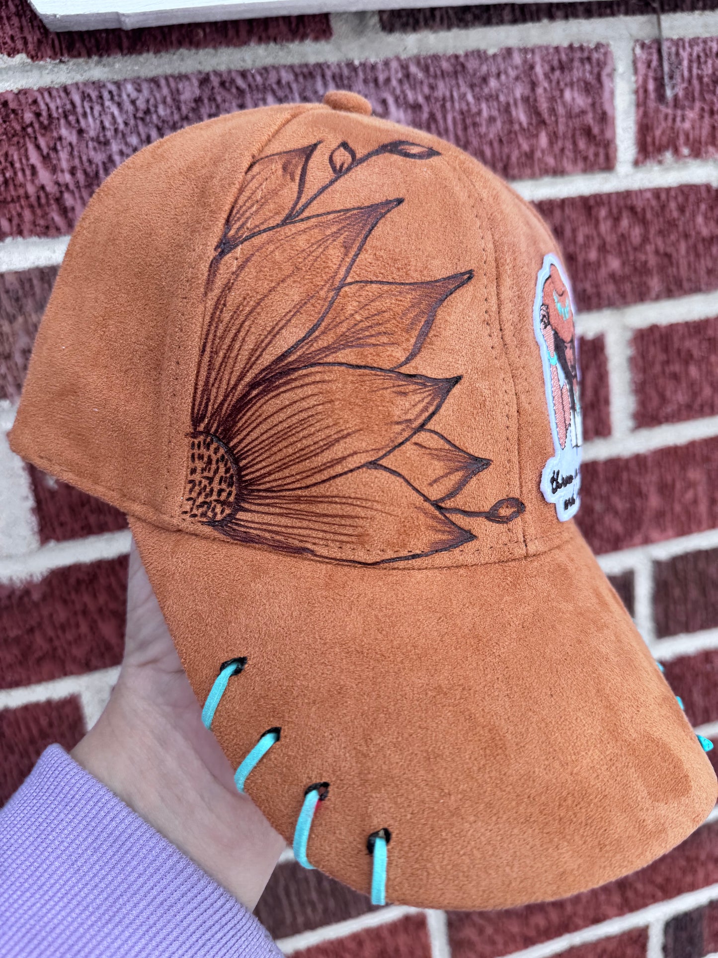 Hand burned turquoise cowgirl adult rts trucker hat.
