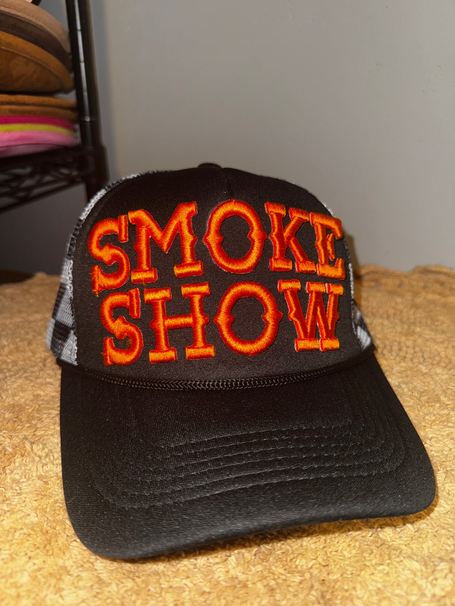 Smoke show black checkered orange letters.  Harley davidson vibes🧡
