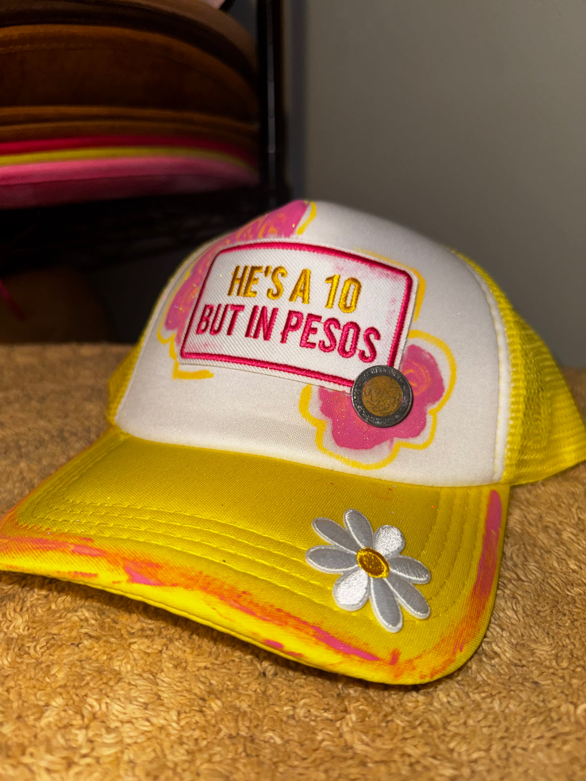 He’s a 10 but in Pesos. Womens trucker hat