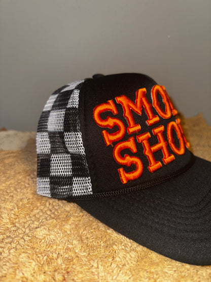 Smoke show black checkered orange letters.  Harley davidson vibes🧡